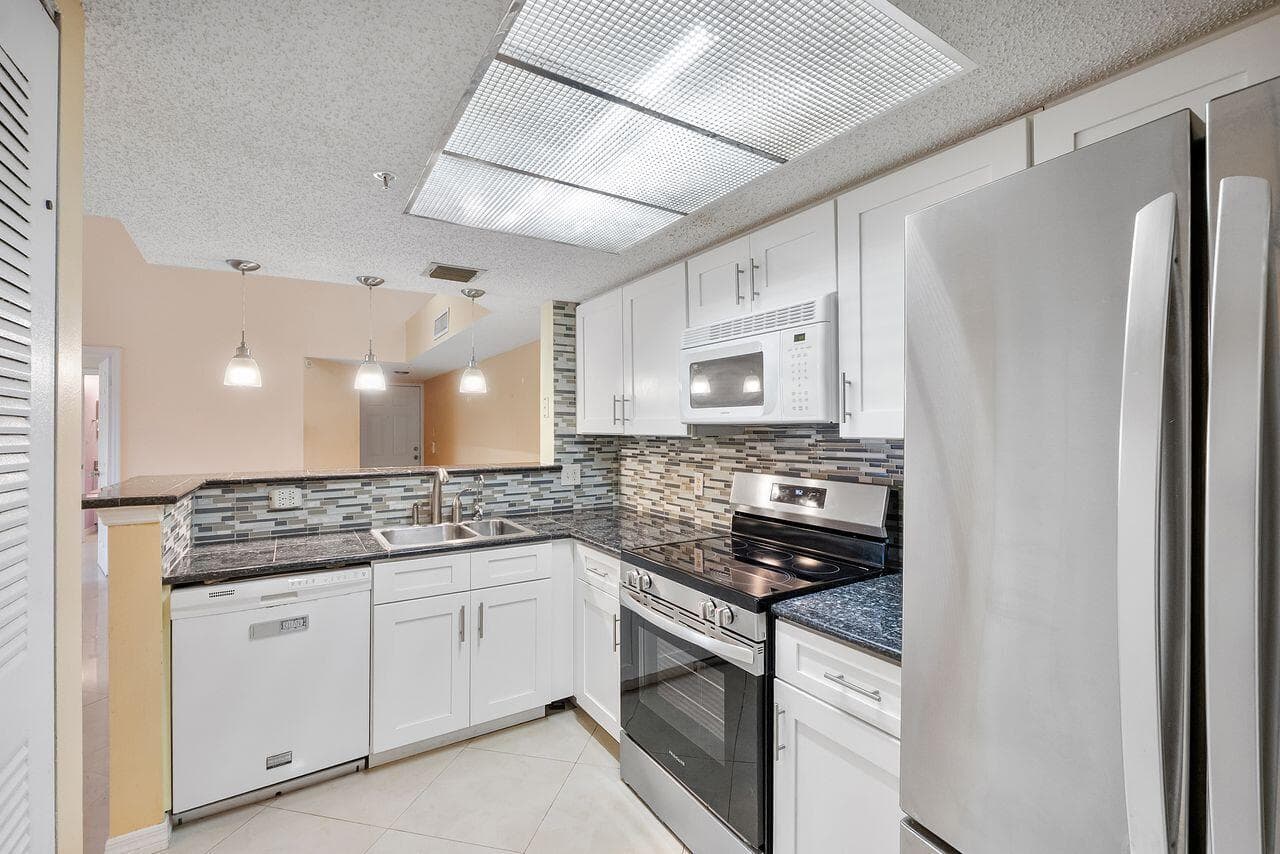 5011 Wiles Road # Unit 303, Coconut Creek, FL 33073 photo 2