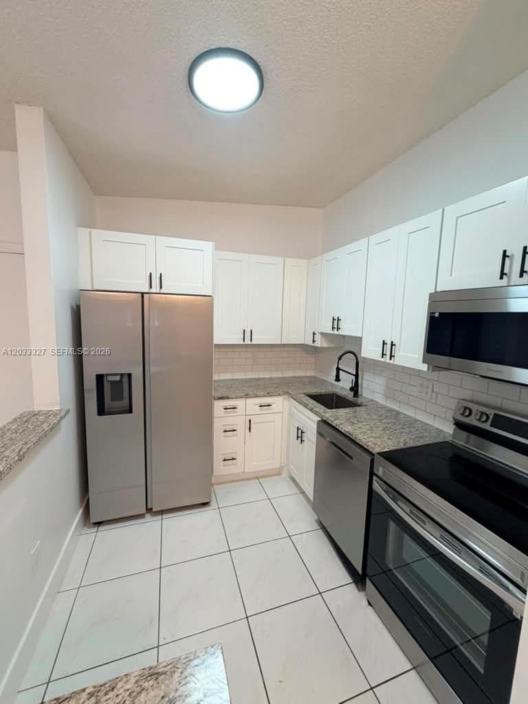 9499 W Mcnab Rd # 208, Tamarac, FL 33321 photo 3