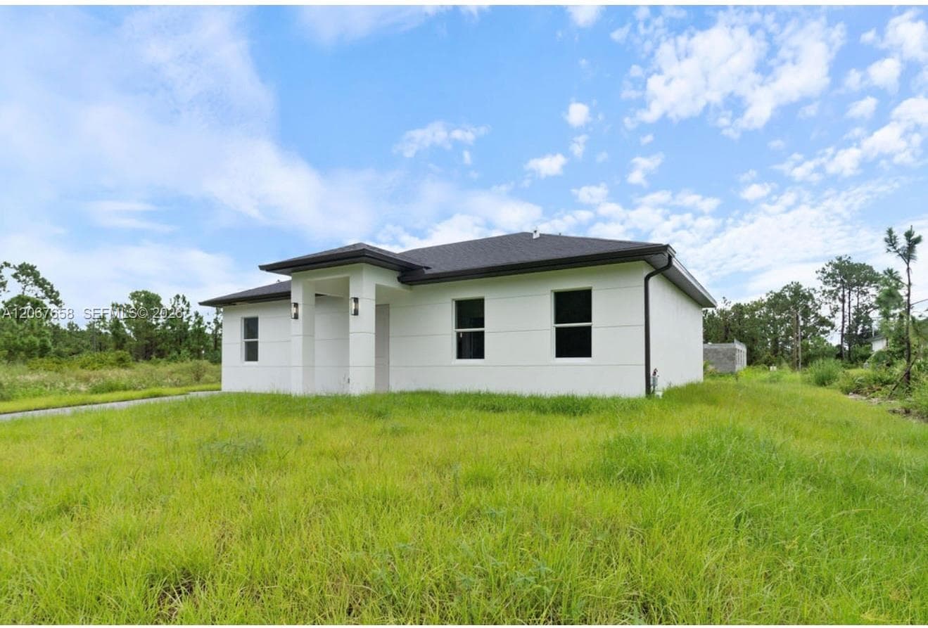 710 Peacock Ave, Lehigh Acres, FL 33974 photo 3