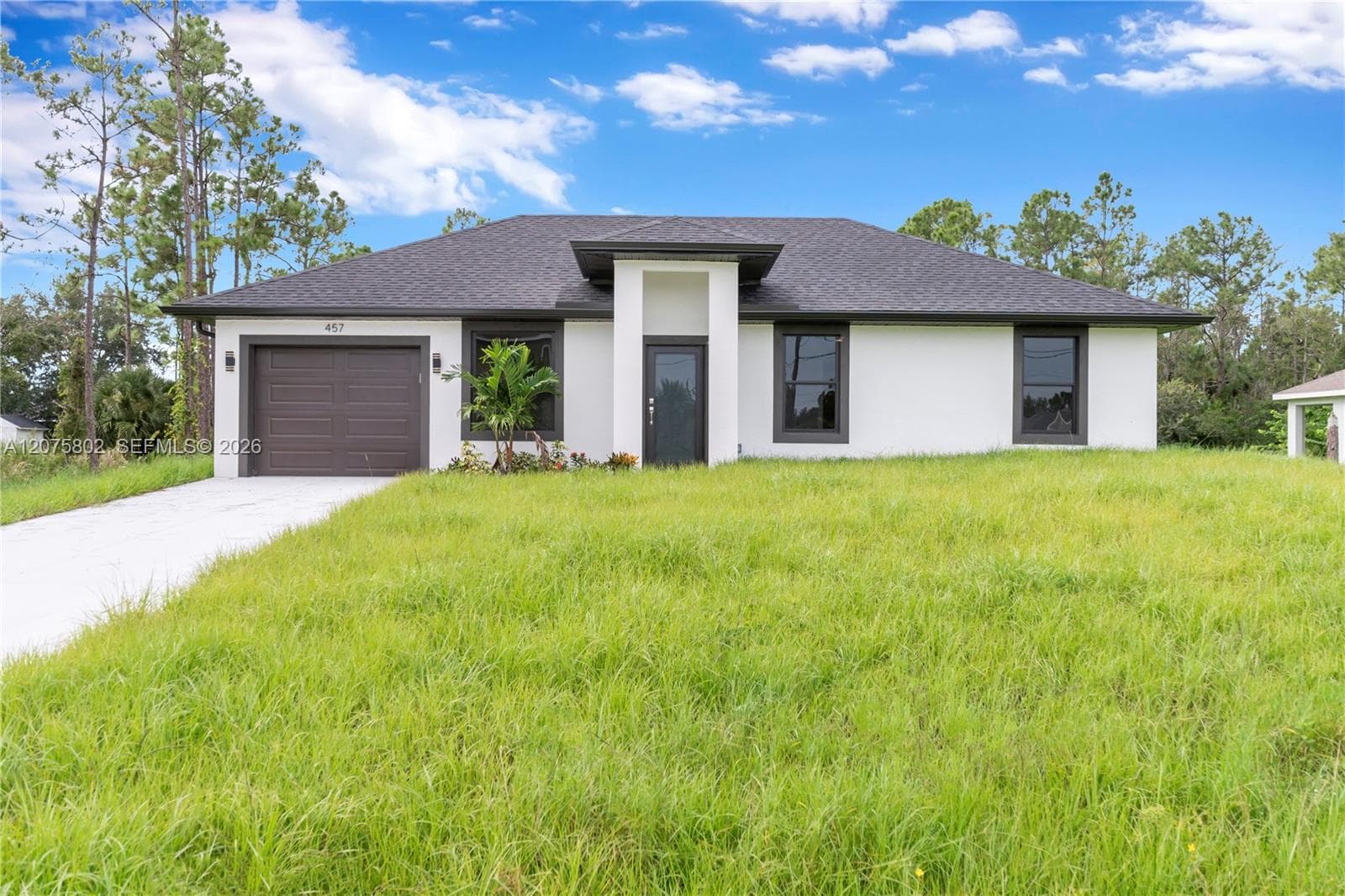 457 Woodman DR, Lehigh Acres, FL 33972 photo 2
