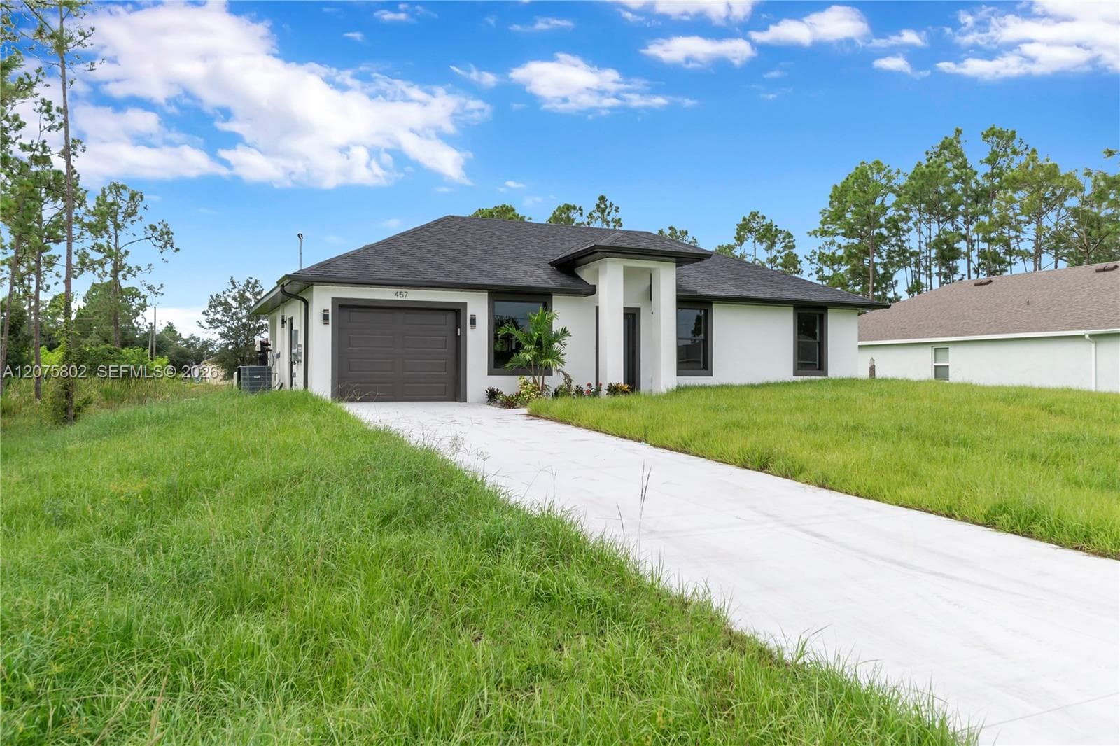 457 Woodman DR, Lehigh Acres, FL 33972 photo 3
